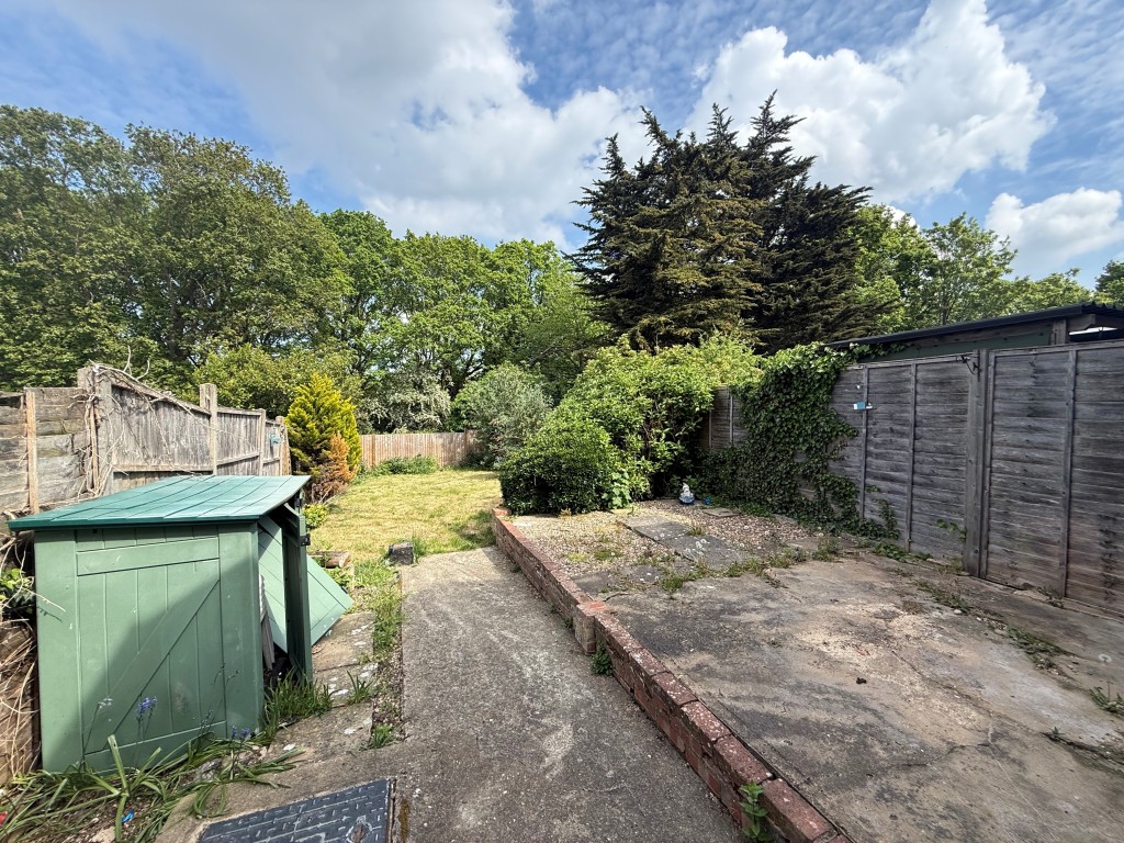 Lot: 143 - TWO-BEDROOM SEMI-DETACHED HOUSE WITH DRIVEWAY - Garden view showing patio